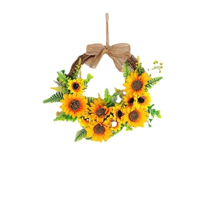 Decorative sunflower wreath with yellow artificial blossoms and natural rattan base