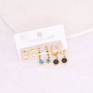 Gold stainless steel earring set with evil eye and star charms on white display card