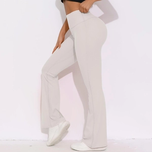 Detail view of high waisted flared yoga pants featuring tummy control and lifting effect