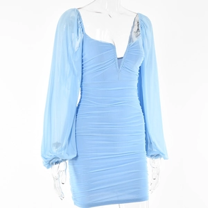 Detail of light blue V-neck mini dress featuring pleated waist and lantern sleeves