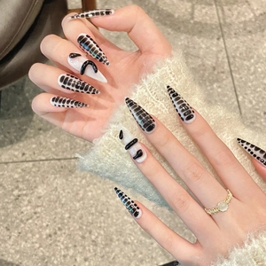 Black and white snake pattern stiletto press-on nails with 3D texture details
