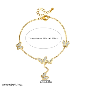 Gold stainless steel butterfly charm bracelet with white shell inlays and tassel chain