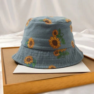Blue canvas bucket hat with sunflower pattern for baby sun protection in summer