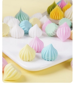Close-up of colorful resin meringue candy props for DIY crafts in macaron pastel tones