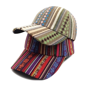 Bohemian style woven baseball cap featuring colorful ethnic stripes and floral patterns