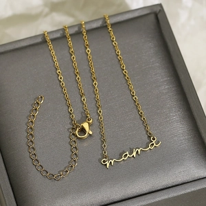 Golden stainless steel necklace with Mama letter pendant in a gray jewelry display box