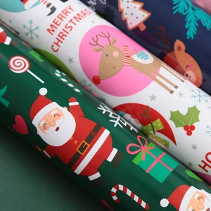Christmas wrapping paper rolls with Santa and reindeer patterns for holiday gifts