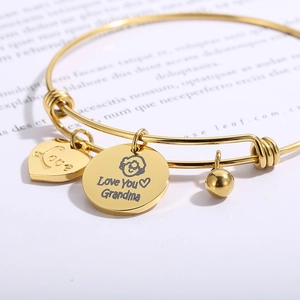 Gold adjustable wire bracelet with heart pendant and Grandma charm on gift card