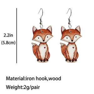 Detail showing the 2.2-inch size and wood material of these cute fox earrings