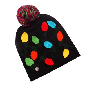 Detail view of black knit Christmas beanie with colorful LED patterns and on off switch
