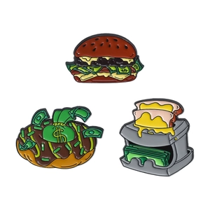 Three-piece fun enamel pins set featuring hamburger, donut, and toaster with dollar bills