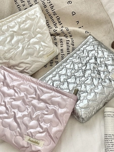Set of three heart quilted PU makeup bags in cream white, pink and silver finishes