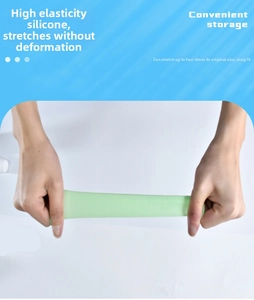 Close-up of flexible light green silicone travel bottle sleeve stretching up to 400%