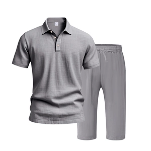 Detail of grey men's polo set showing waffle texture fabric and drawstring waist