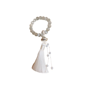 Elegant lotus cat eye stone bracelet with white silk tassel in New Chinese style design