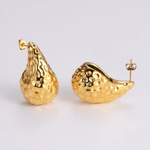 Detailed macro view of 18K gold plated stainless steel teardrop earrings with hammered texture