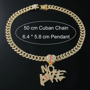 Detail view of 50cm gold Cuban chain with 6.4x5.8cm iced out NO LOVE broken heart pendant