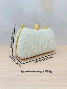 Elegant pearl evening clutch bag with gold frame and chain strap for wedding party