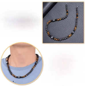 Detail of 8mm tiger eye beads and black hematite squares on a lava stone yoga necklace