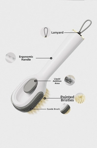 Detail of ergonomic long handle shoe brush with dispenser and dual bristle texture