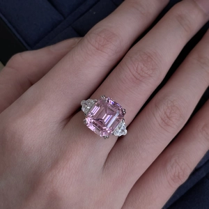 Sparkling pink emerald cut zircon open ring with side stones in silver-tone finish