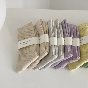 Vertical ribbed cotton socks in various pastel colors with high quality speckled yarn finish