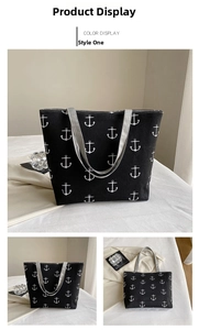 Detail view of large canvas tote bag with white anchor print and grey straps