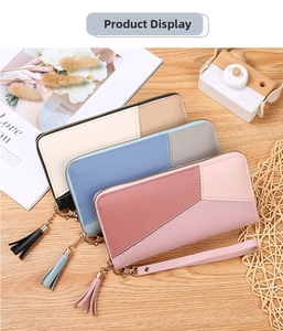 Three long patchwork wallets in blue, pink and white PU leather with tassels