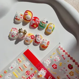 Detailed view of 3D embossed rabbit nail art stickers with festive Chinese New Year patterns