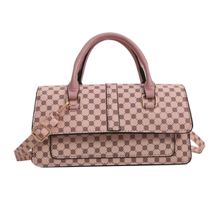 Pink lychee texture crossbody bag with floral pattern and golden hardware accessories