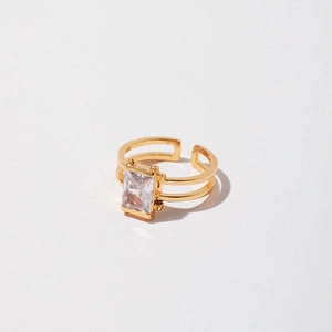 Detailed macro view of the gold adjustable ring with rectangular zircon and open-band design