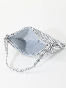 Macro detail of silver rhinestone mini evening bag showing spacious interior with silk lining