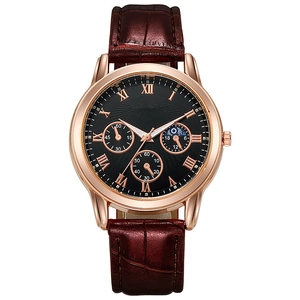 Detail of black sunray dial with rose gold Roman numerals and brown leather strap