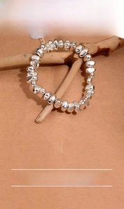 Irregular silver beaded bracelet 21.5cm made of silver-plated copper on wood