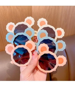 Multiple pairs of cute bear ear children's sunglasses in pink and blue colors for kids
