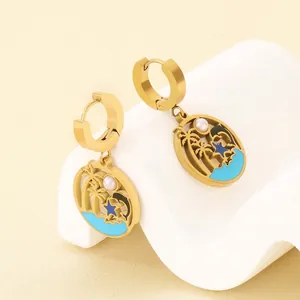 Tropical gold stainless steel earrings with palm tree and blue enamel ocean pendant
