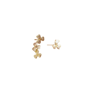 Asymmetric gold plated zircon flower stud earrings with white petals on white backdrop