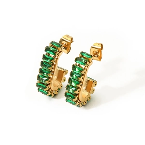 Detailed close-up of C-shaped earrings with emerald square zircons in 18K gold-plated steel
