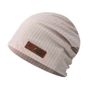 Detail of pink ribbed beanie showing leather patch with metal fishbone accent and logo