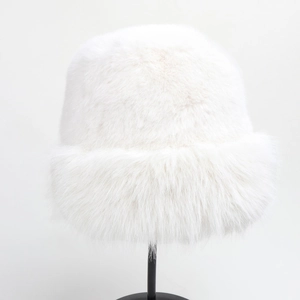 Close-up of thick white faux fur texture on a warm winter bucket hat for women