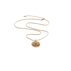 Detailed close-up of gold-plated evil eye pendant with zircon stones on snake chain