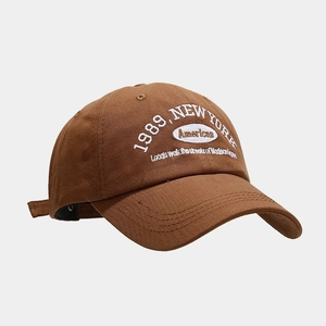 Close-up of 1989 New York white embroidery on brown soft-top cotton baseball cap