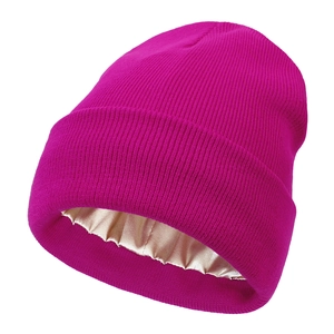 Detail view of purple knit beanie featuring a smooth satin lining for hair protection