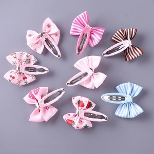 Set of 8 colorful bow hair clips with stripes and floral prints for girls