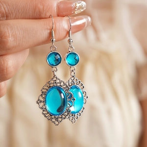 Vintage bohemian oval blue resin drop earrings with silver lace hollow design for women
