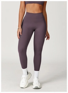 Macro detail of high-waist yoga pants in deep purple with elastic high-stretch fabric
