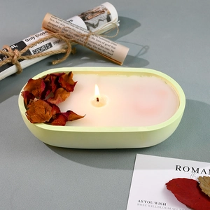 Boat shaped candle mold set with light green frosted vessel and dried rose petals