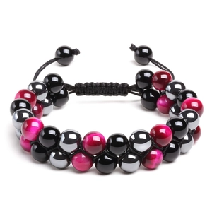 Macro detail of adjustable woven bracelet with rose cat-eye and hematite stone beads