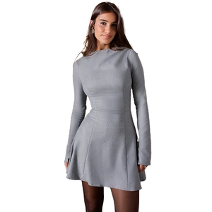 Detail of grey slim fit mini dress showing the long sleeves and soft ribbed fabric texture