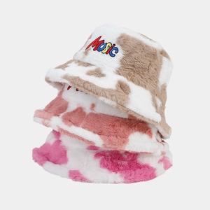 Plush cow print bucket hats in brown, pink and rose red with Music embroidery detail